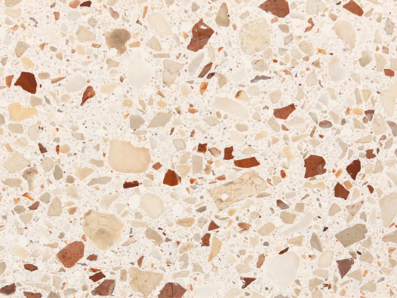 terrazzo com cores neutras e naturais, com grão pequeno e médio / terrazzo with neutral and natural colors, and médium-size grain stones.
