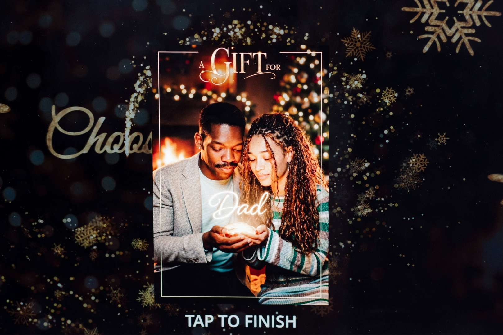 The Gift holiday experience on Epic Events' booth
screen showing a couple's 'A Gift for' design, for
parties in MD & VA