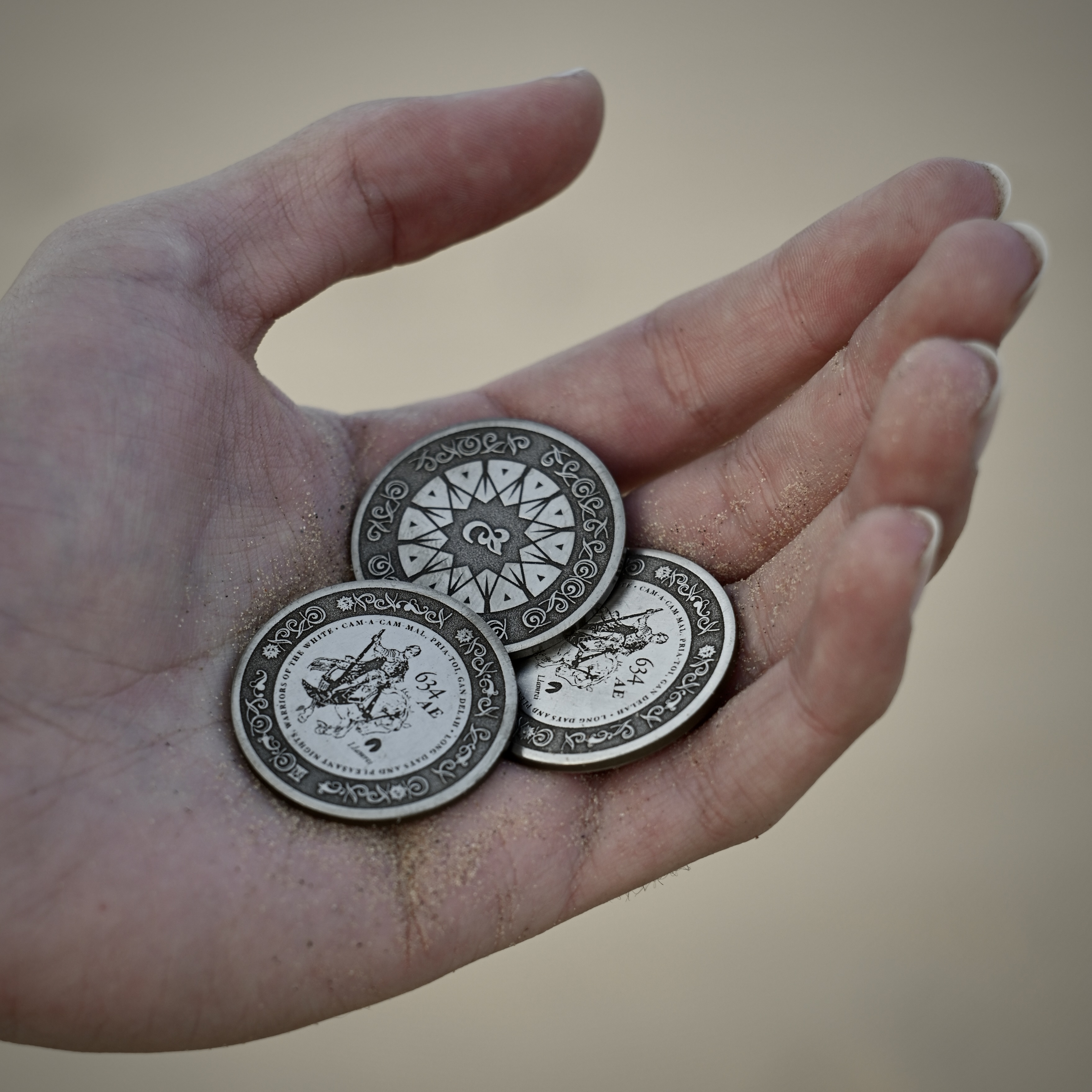 Laser engraved silver coins, minted dates before the the fall of Gilead