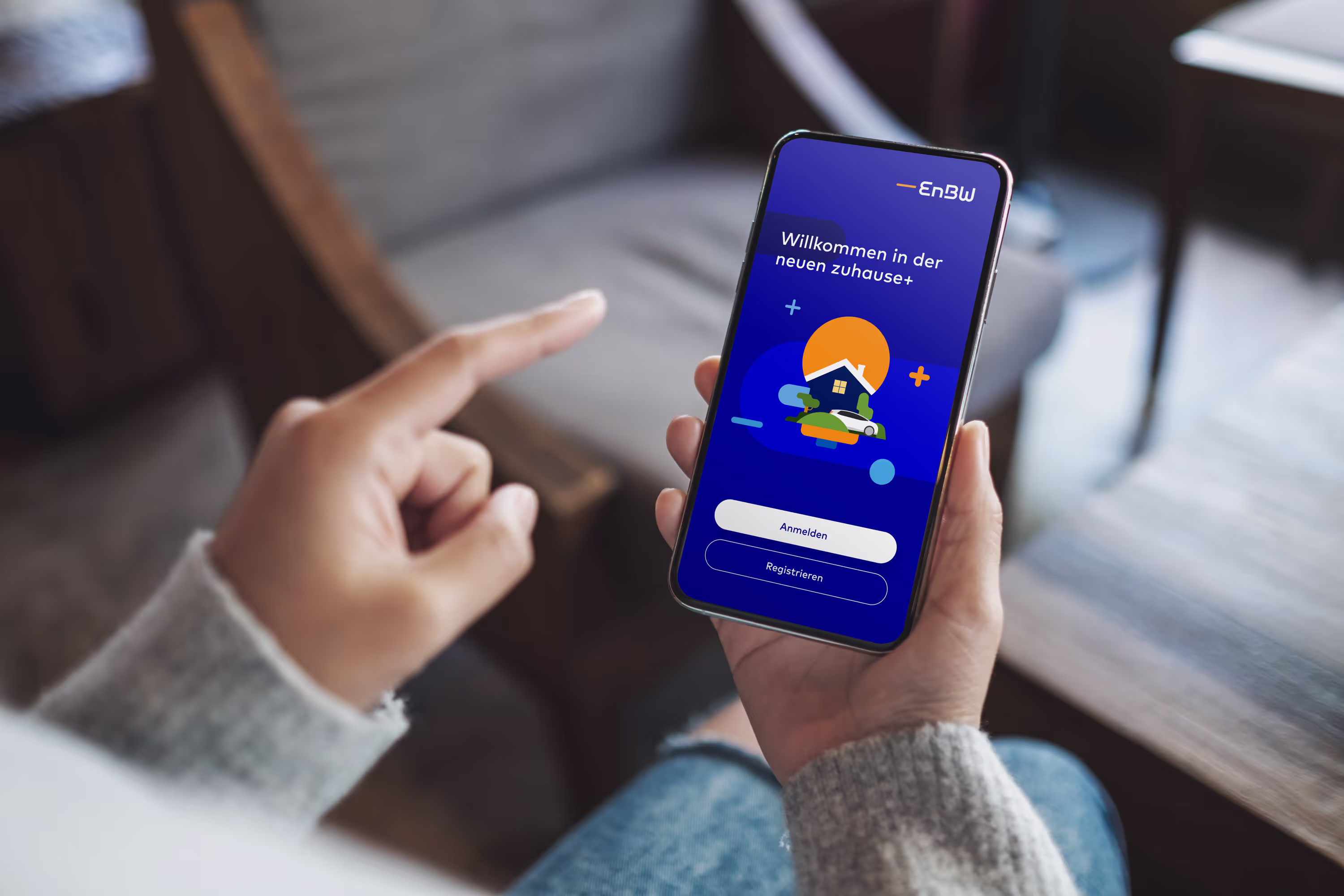 Smartphone with welcome screen of the EnBW zuhause+ app