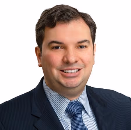 A headshot of John Elbasan - Willkie Farr & Gallagher's CIO