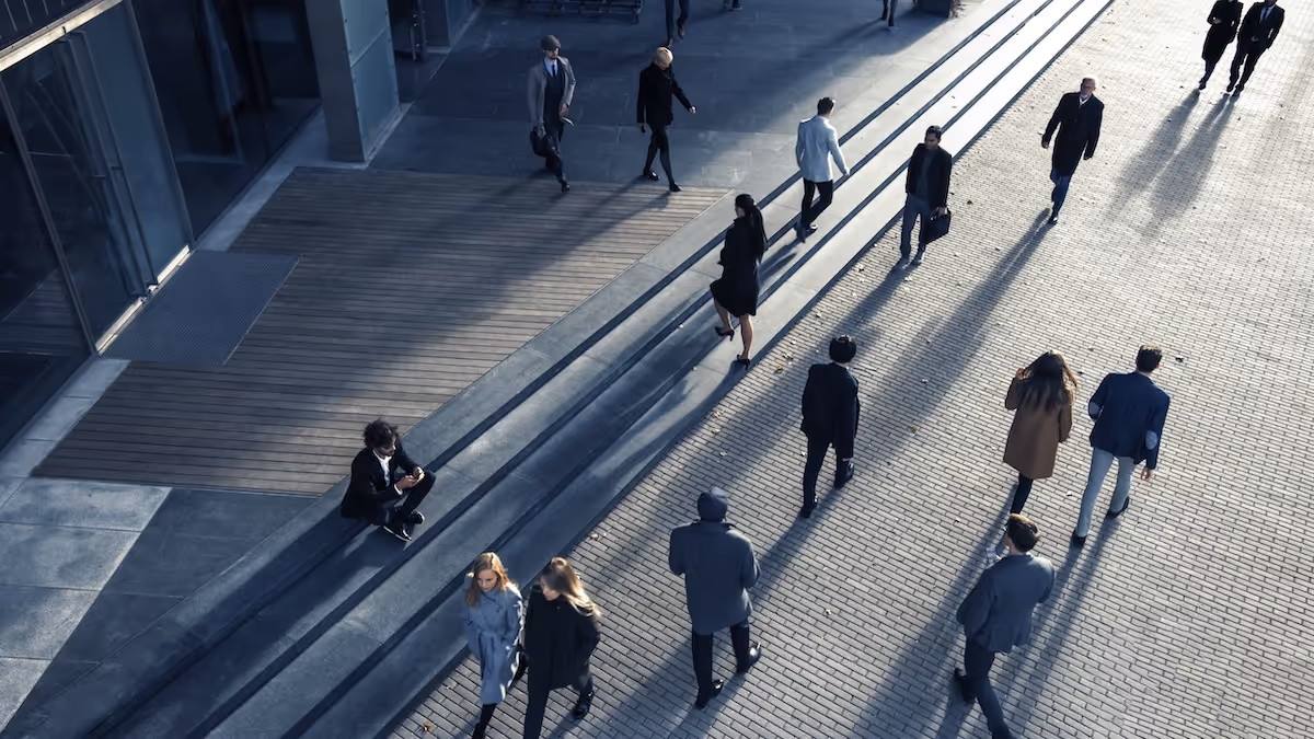 An aerial shot of people walking near a courthouse.