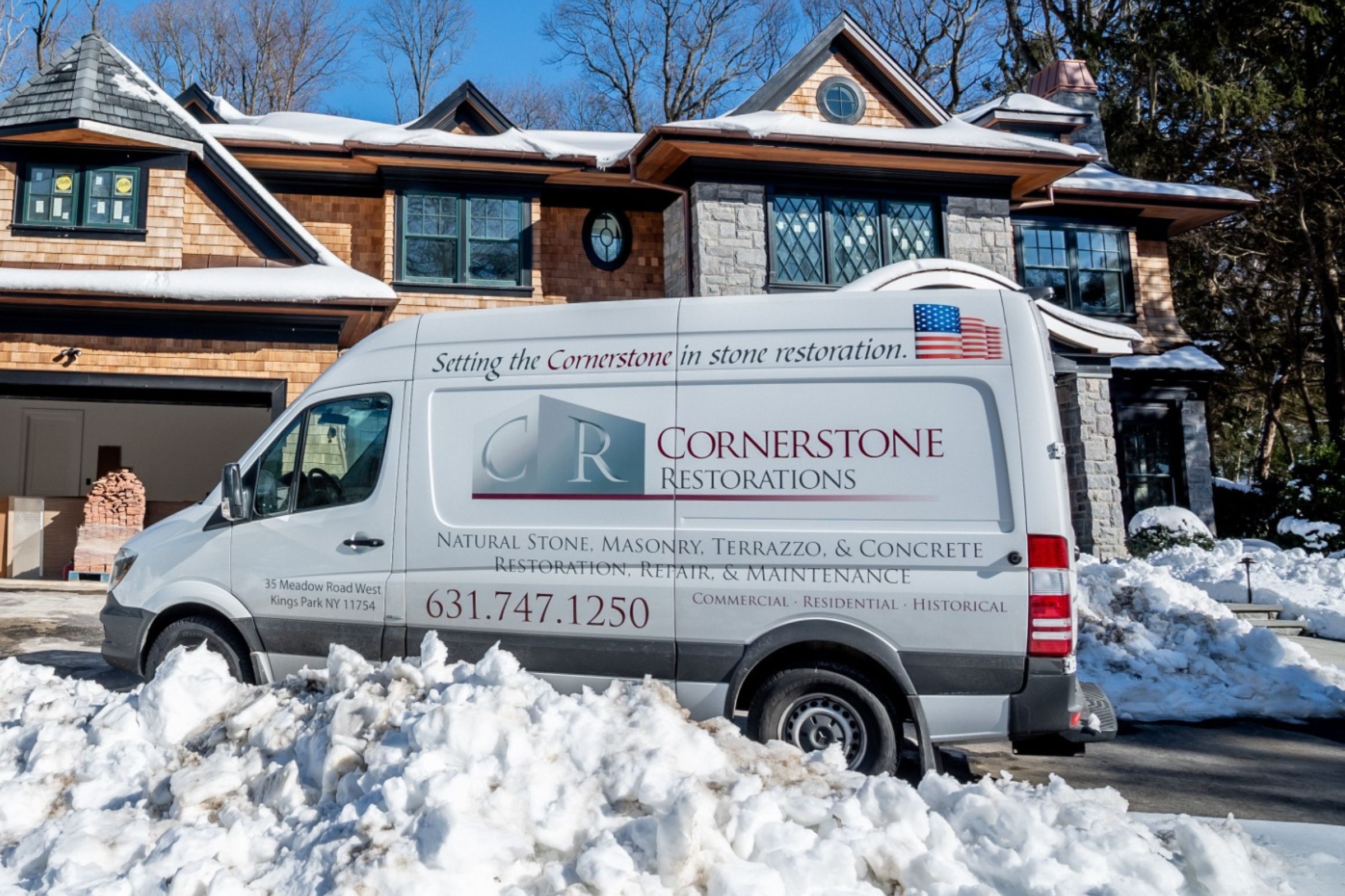 Cornerstone service vehicle in winter conditions outside a residential property