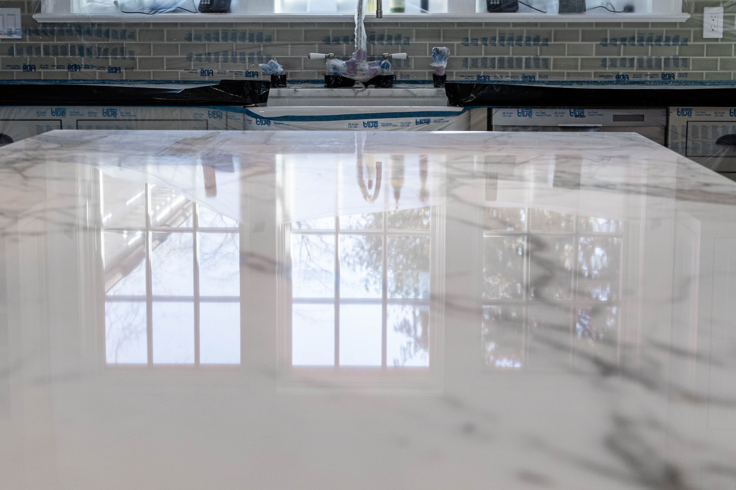 Polished natural stone countertop showing reflection and finish quality