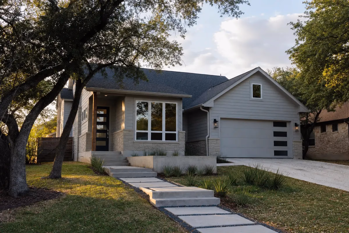 Finished fiber cement siding and window trim installation on an Austin home
