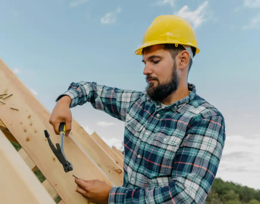 A Worker Fixing a Roof