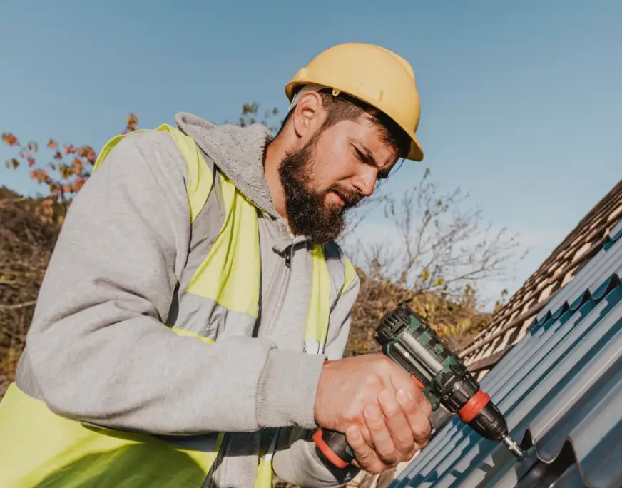 A Worker Fixing a Roof