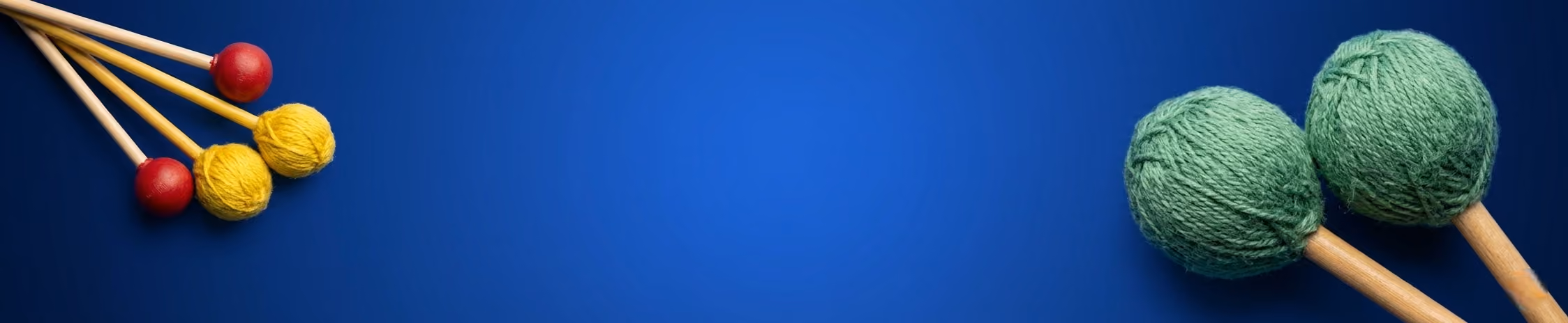Marimba ans xylophone mallets with a blue background