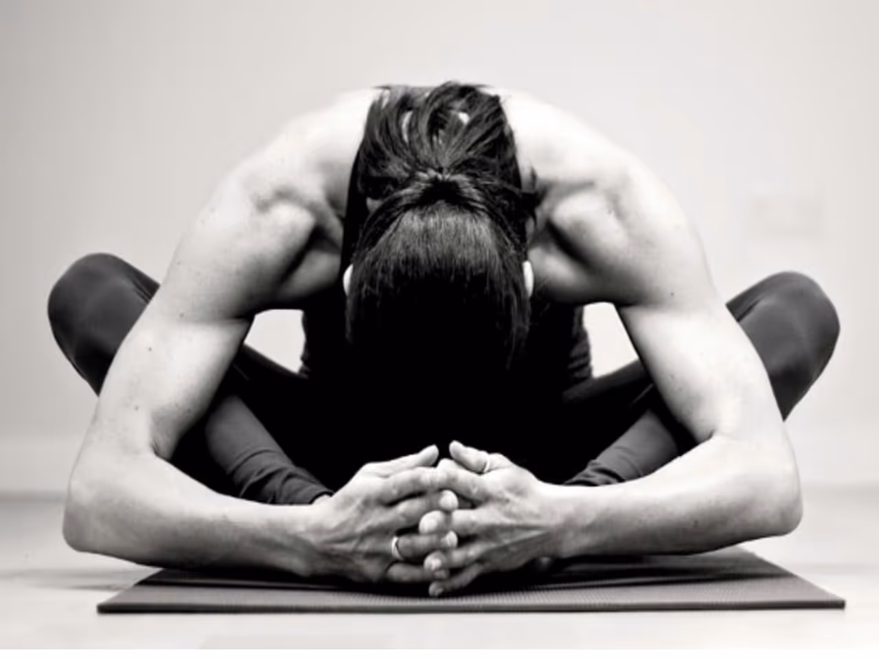a woman practicing yin yoga