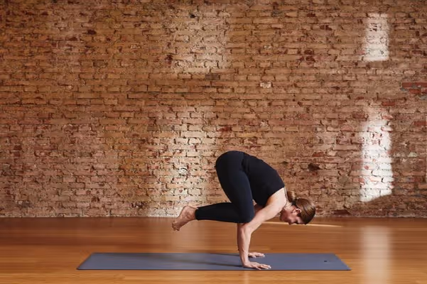 a man is doing ashtanga yoga