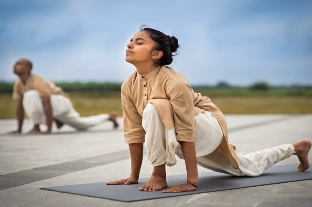 A lady and a gentleman doing hatha yoga