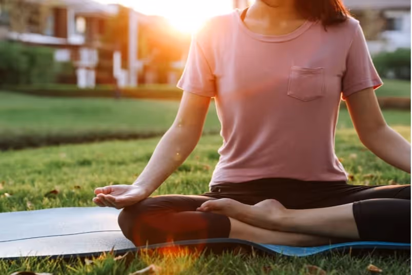 A woman doing yoga and breathing exercises