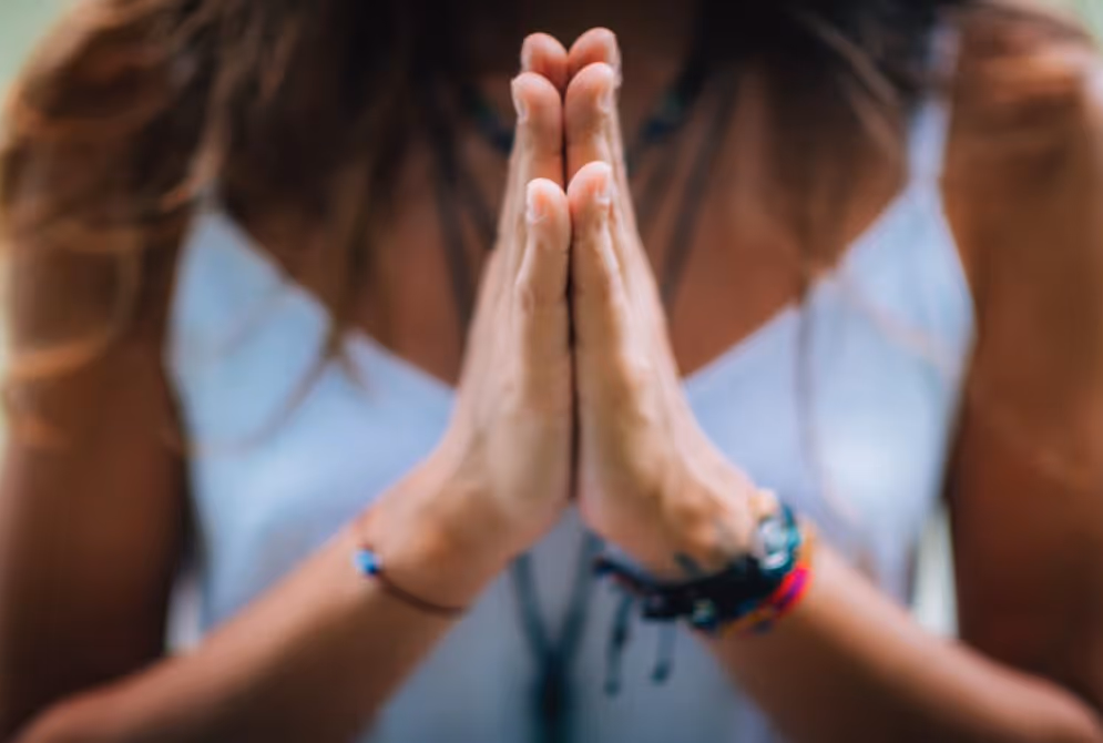 Yogi lady's hands in Namaste positionز
