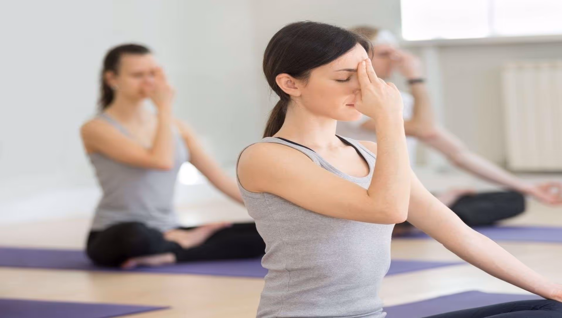Yogi ladies practicing pranayama