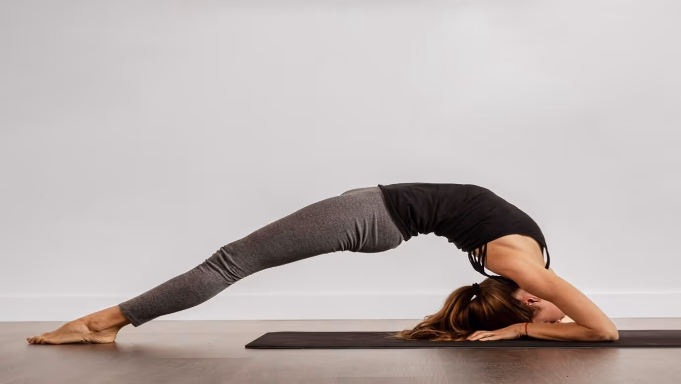 Fit woman doing yoga at home
