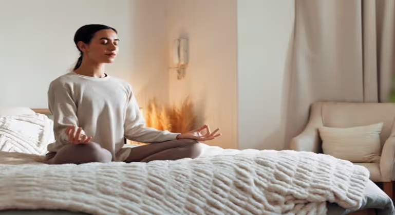 Yogi lady meditating in her home and bedroom