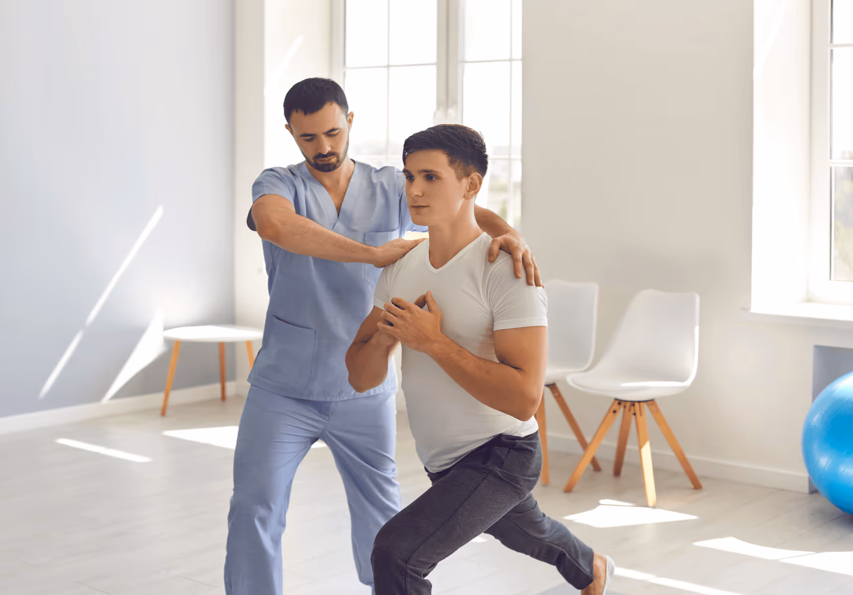Two men in a yoga therapy session after an injury