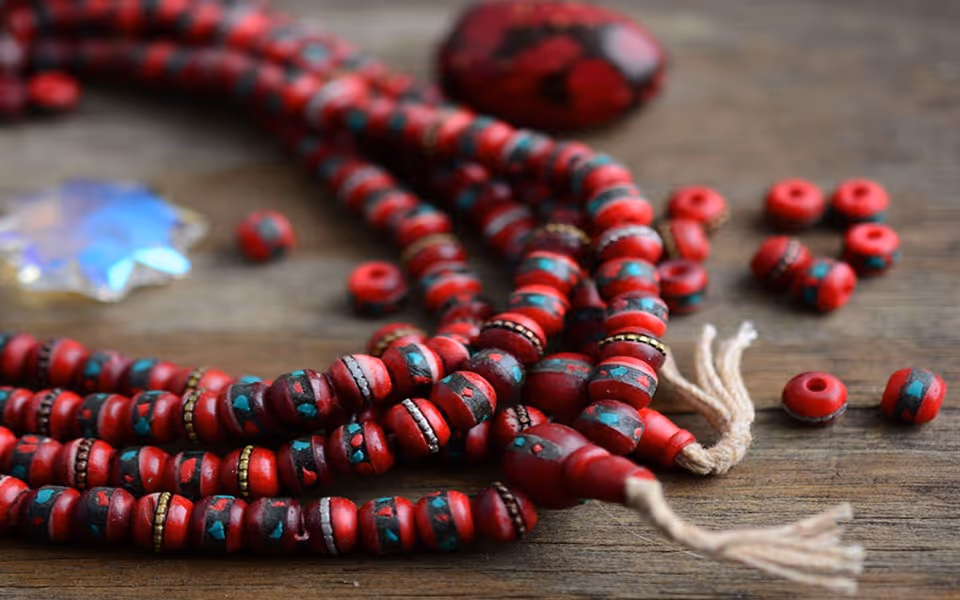 Red rosary and glass piece