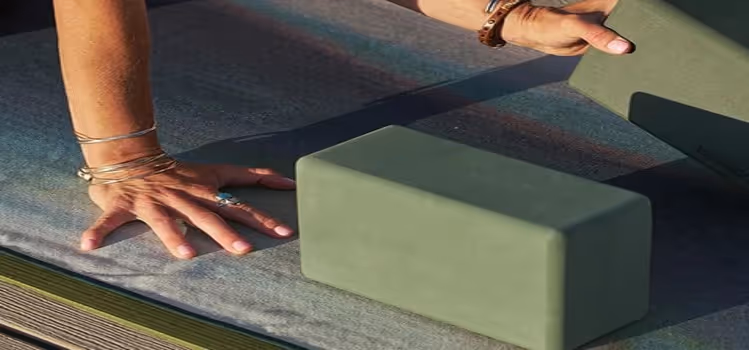 Yoga bricks on text and yogi hands and ring