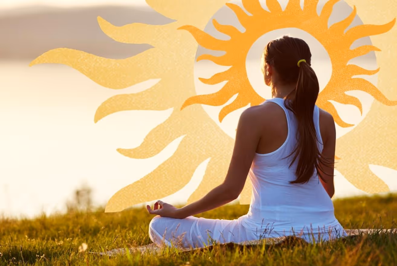 A yogi woman sitting in lotus position on a grassy field with sun-like graphics around her head.