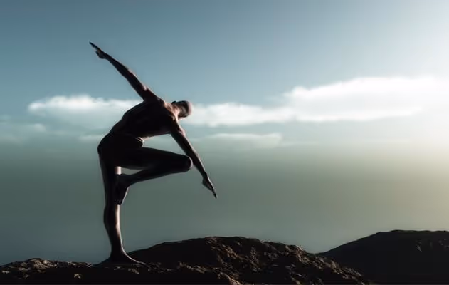 Yogi man doing asana on top of mountain