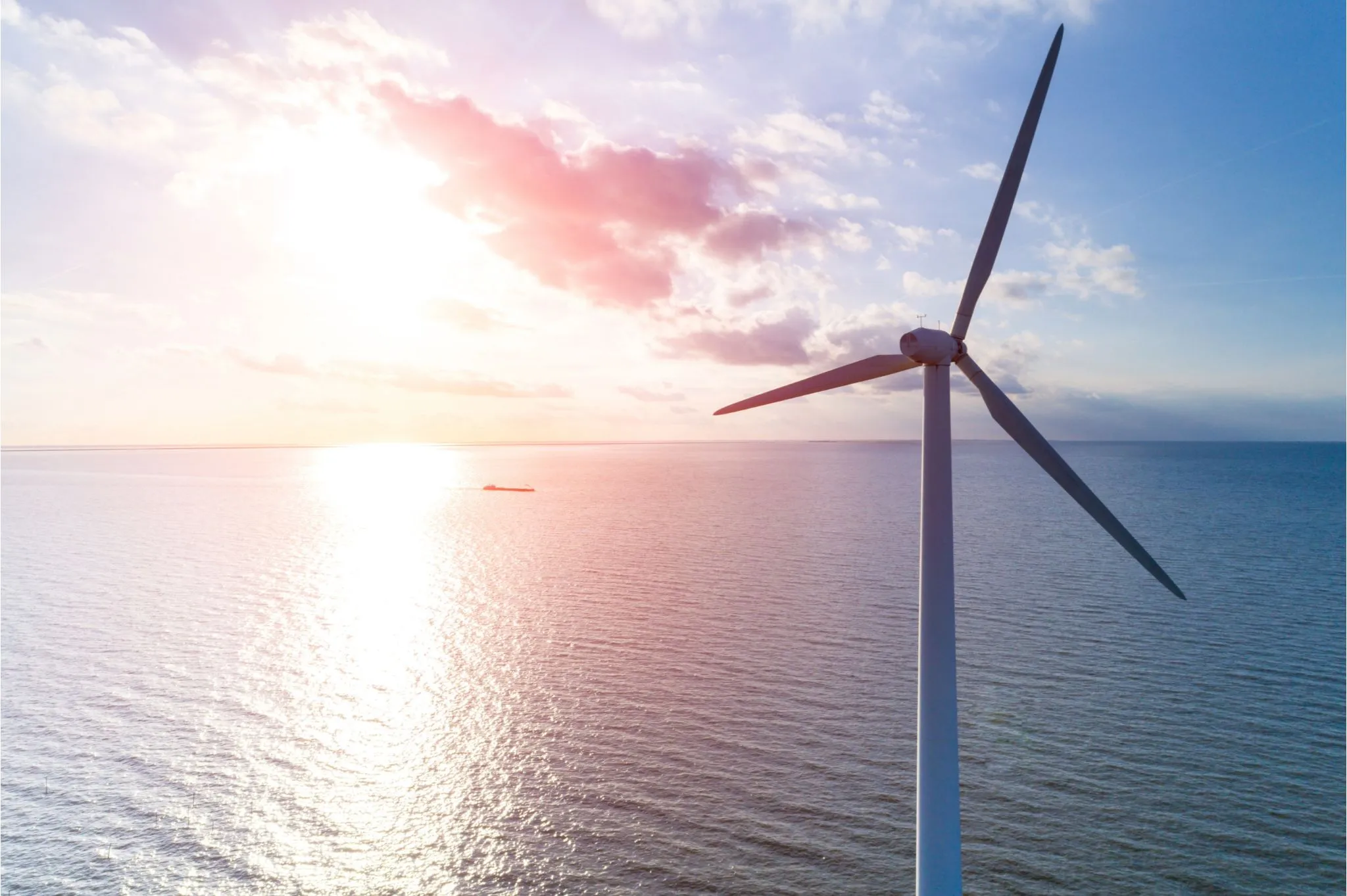 close up of wind turbine at sunset