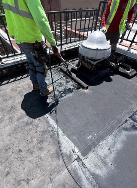 New membrane and flashing along the parapet edge