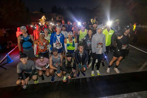 a group of solo runners pose for a picture before the race starts