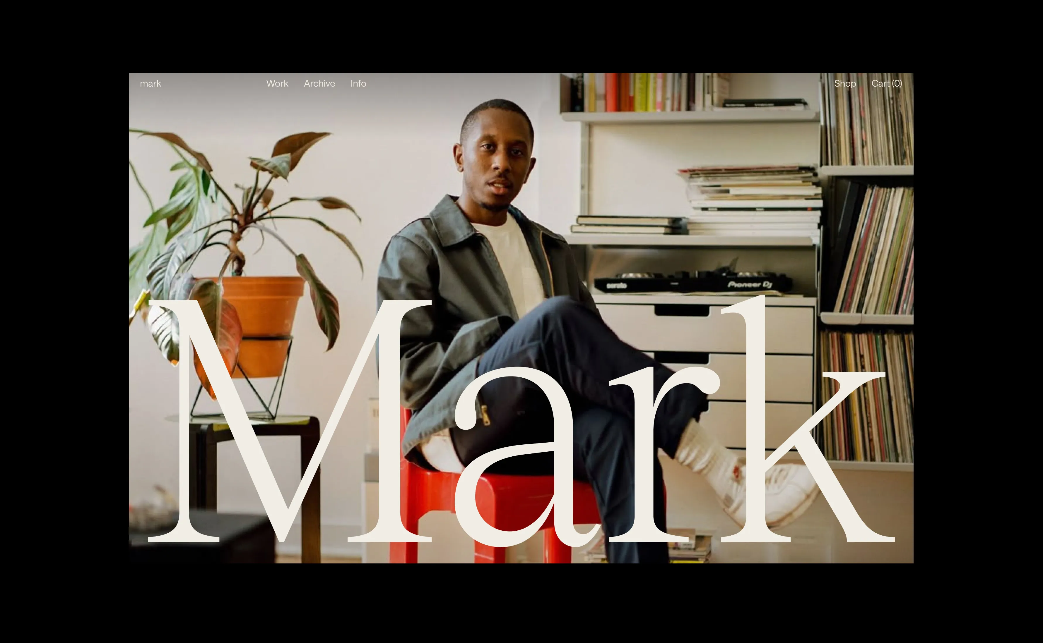 Mark Duggan - About page. Mark sitting in his studio