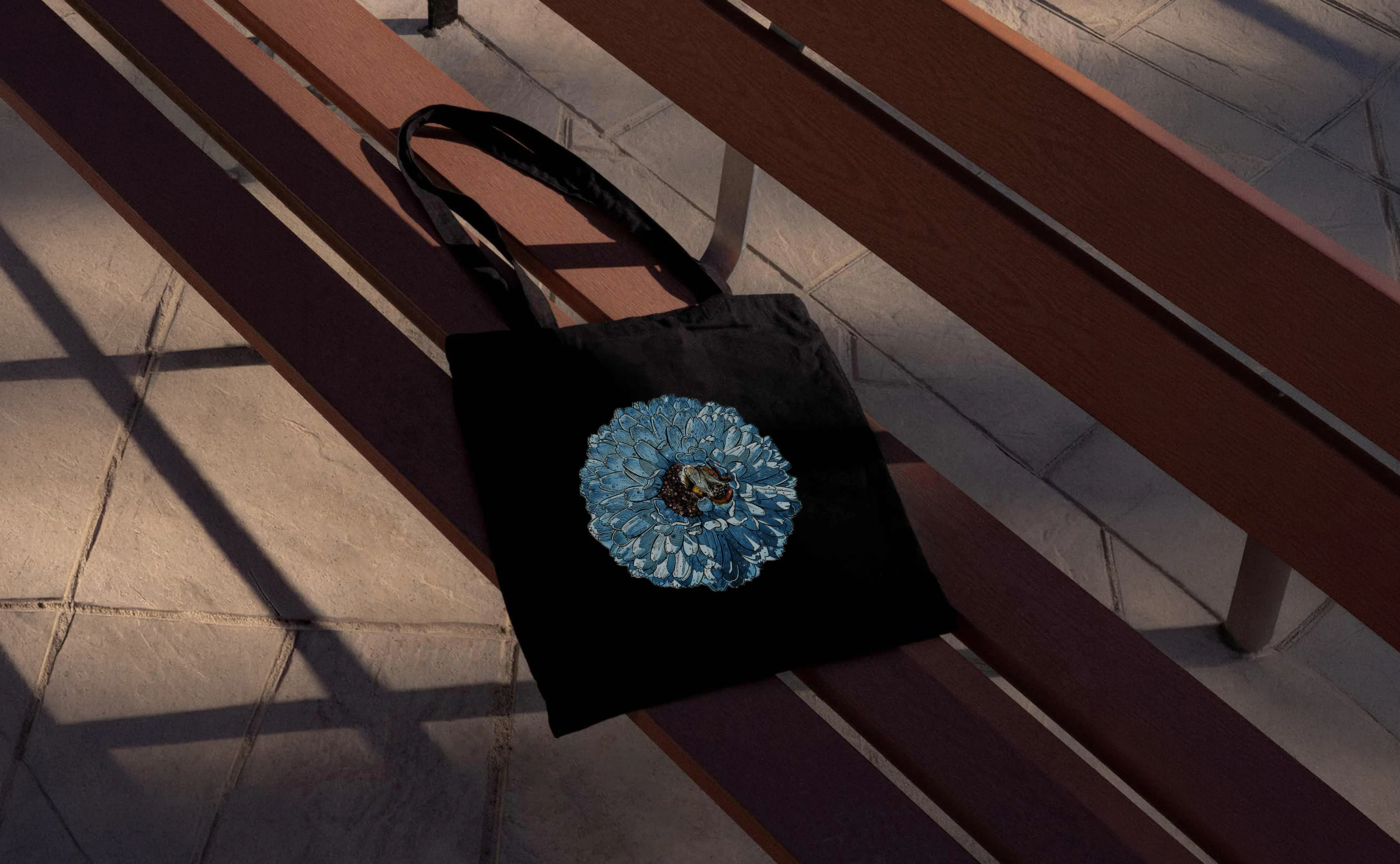 Artist Mark Duggan Tote bag with bee in a blue flower printed on it