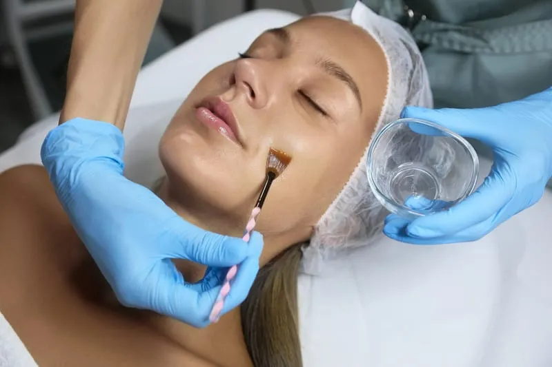 aplying mask on girl's face