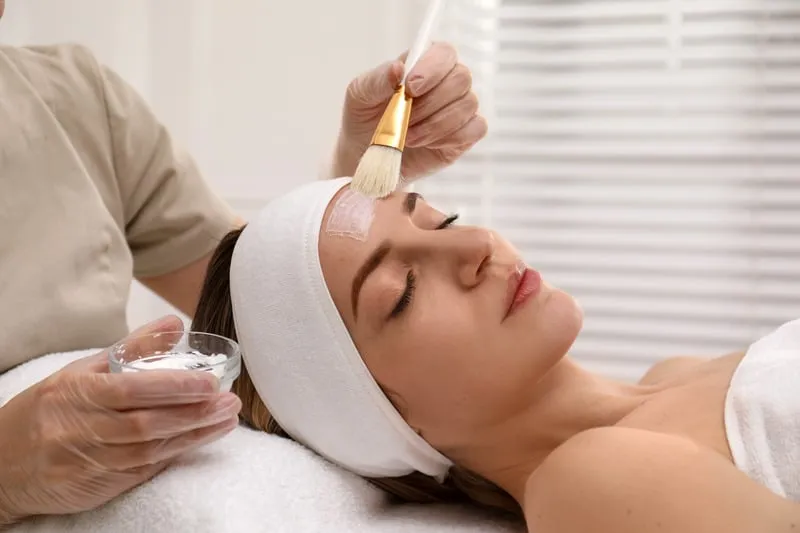 aplying mask on girl's face