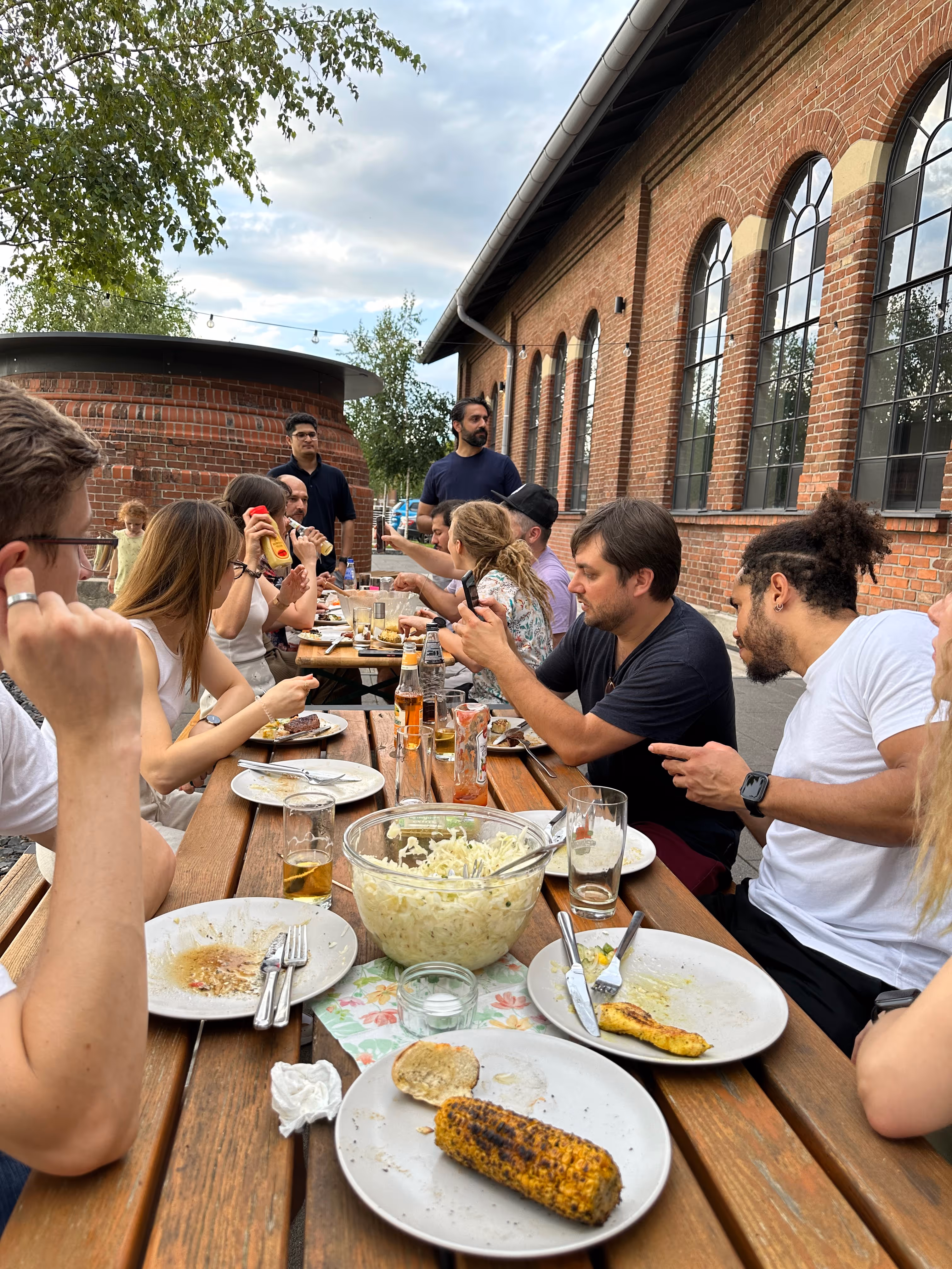 foobaristas sitting outside on the terrace during a BBQ