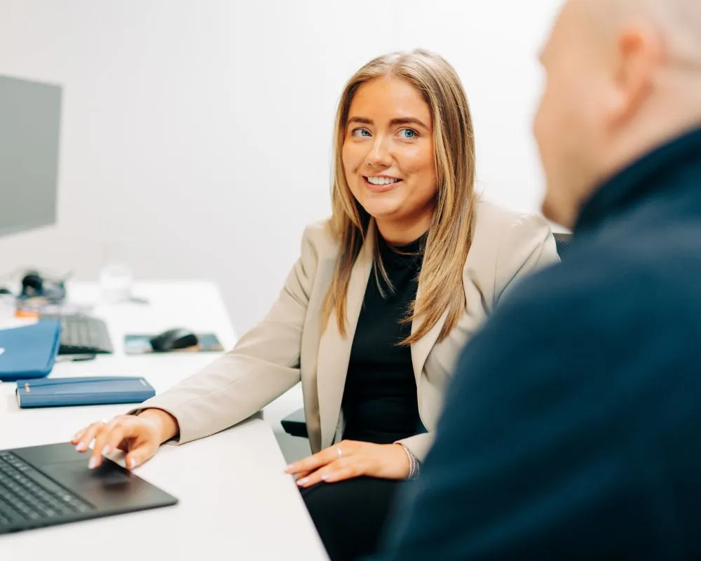Office woman smiling to coworker