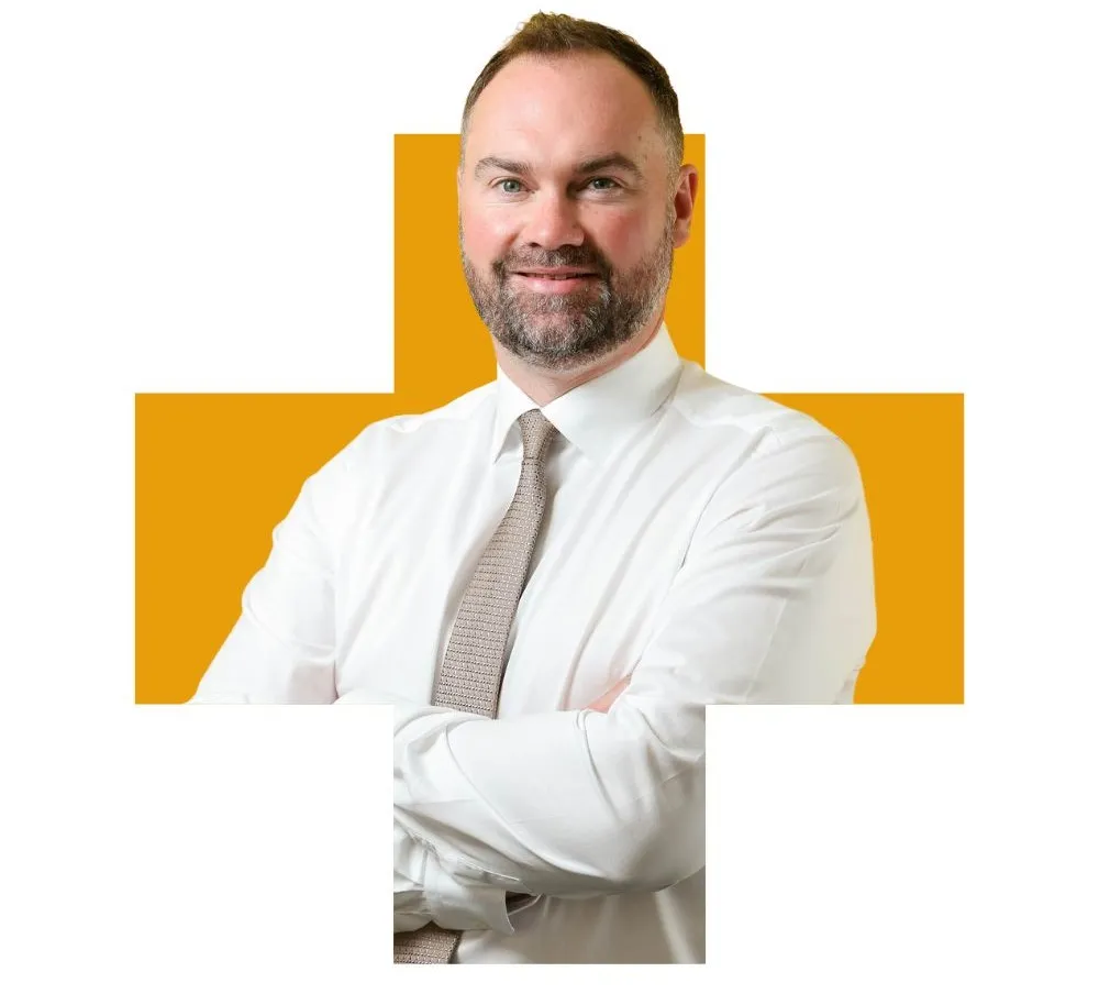 man smiling in a plus shaped frame