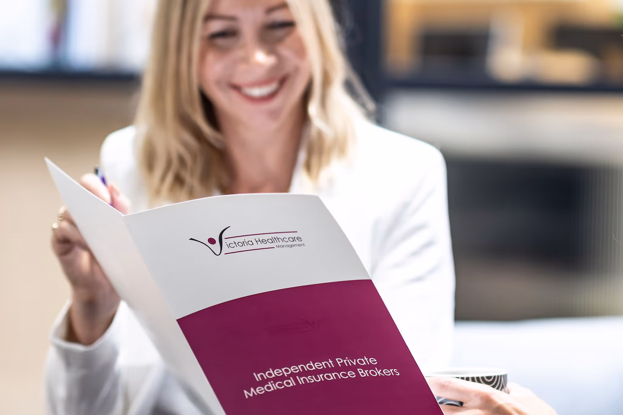 Victoria showing a client their brochure.