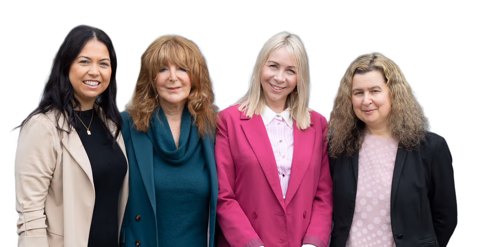 Four women standing together, smiling at the camera. They are wearing professional attire.