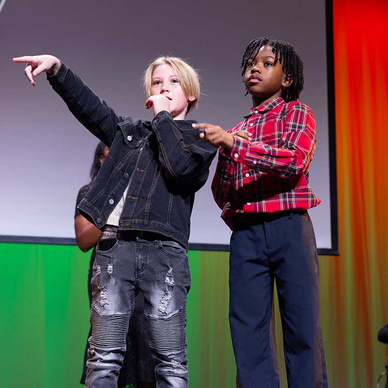 Kids on stage performing. 