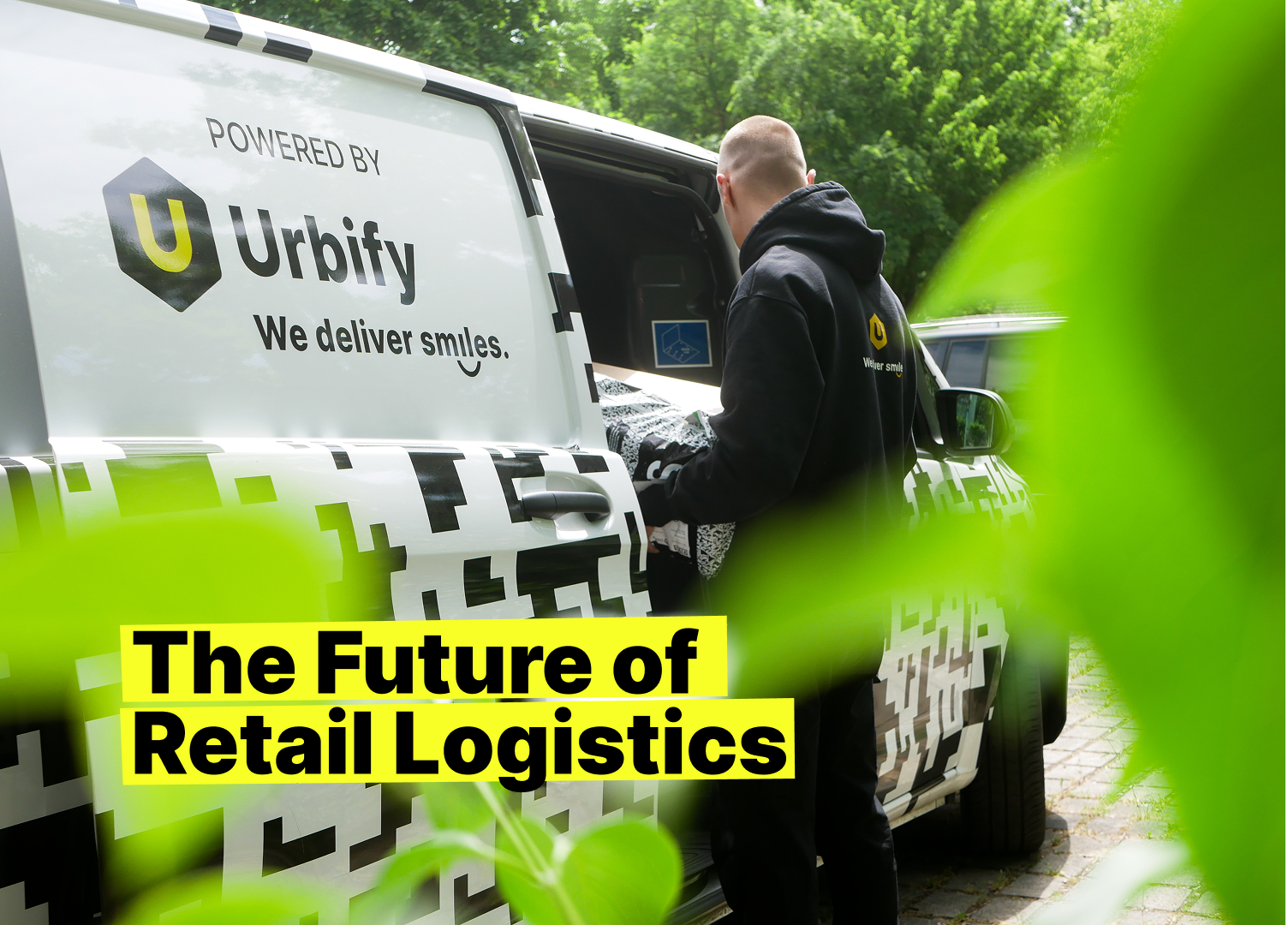 Delivery van with Urbify branding and courier loading a package, highlighting modern logistics innovation.