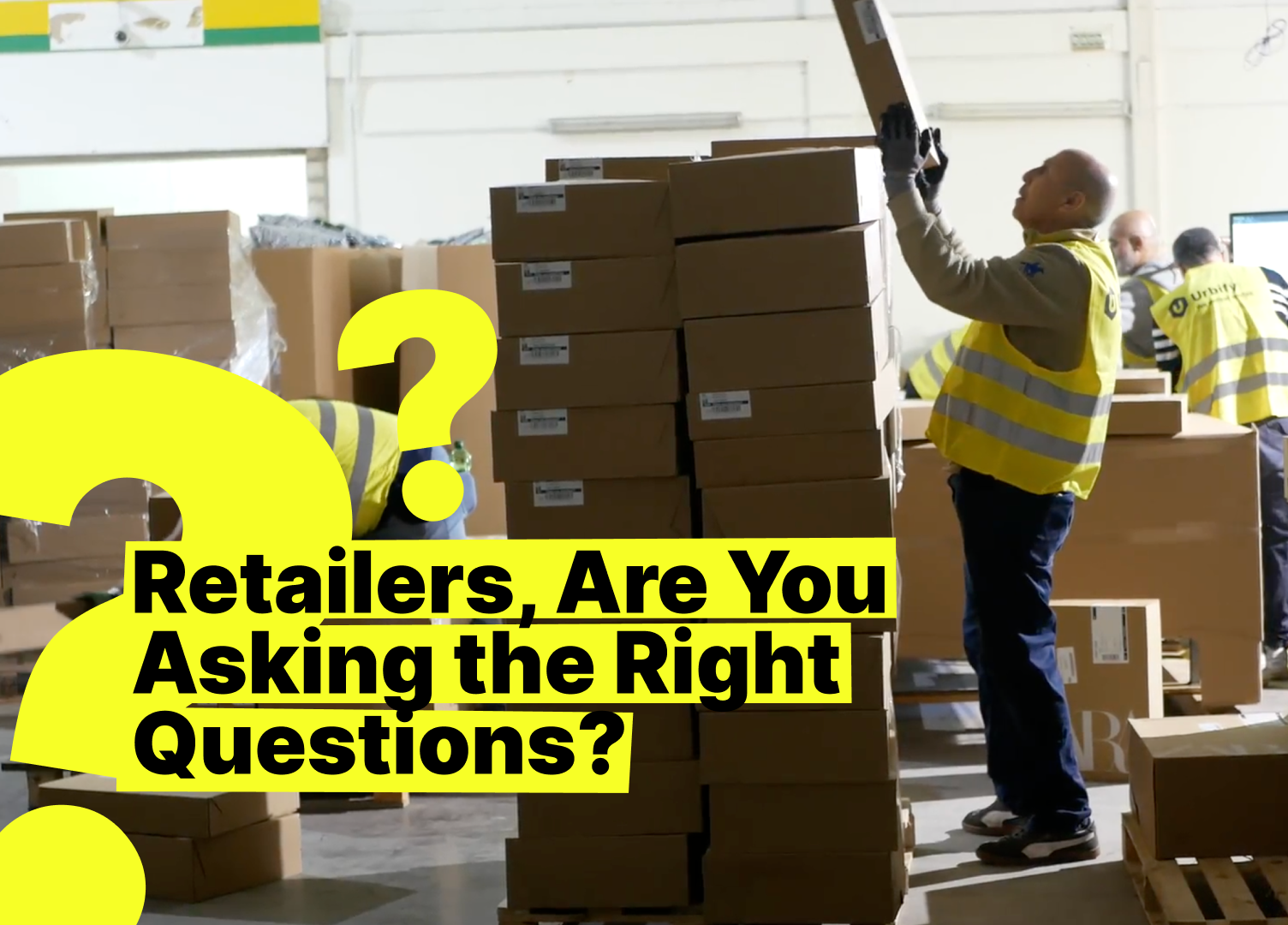 Warehouse logistics scene with workers in safety vests stacking boxes; prominent yellow question mark and headline: “Retailers, Are You Asking the Right Questions?”