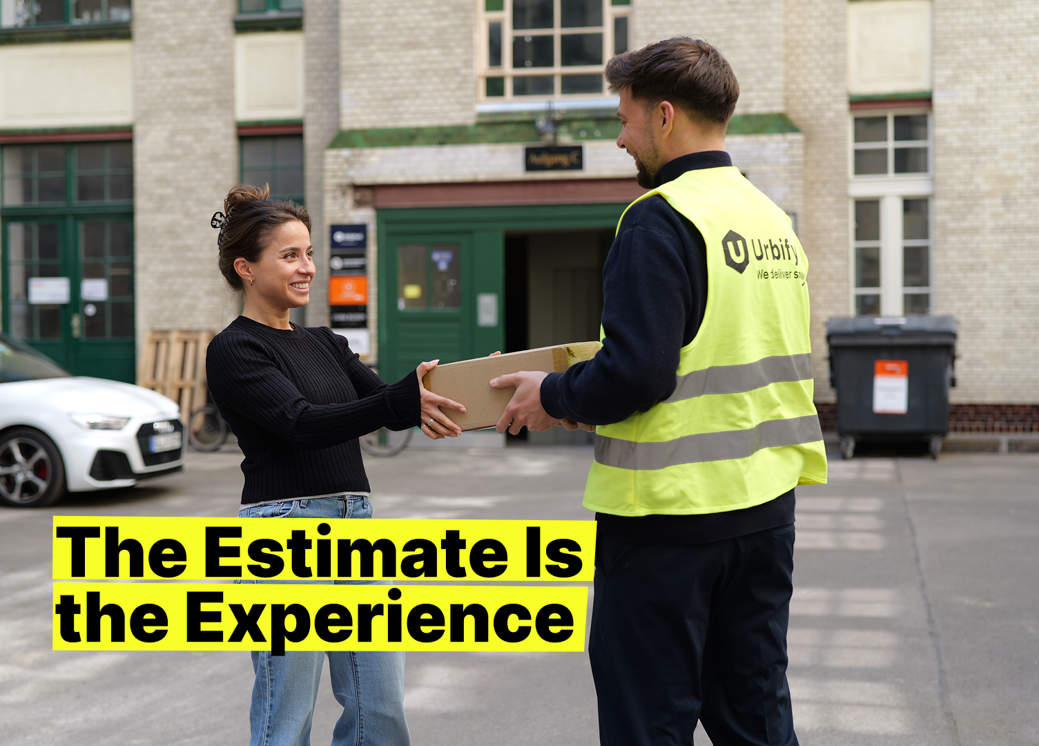 Smiling customer receives a package from an Urbify courier in a bright yellow vest; tagline “The Estimate Is the Experience” highlights reliable 1‑hour delivery windows.