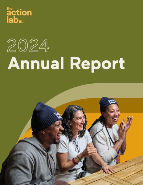 2024 Annual Report cover featuring three people laughing at a wooden table