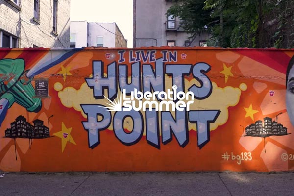 Colorful mural reading “I Live in Hunts Point” with the Liberation Summer logo