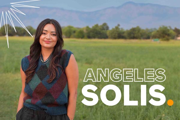 Graphic shows a person standing in a field with mountains behind them and text reading “Angeles Solis.”