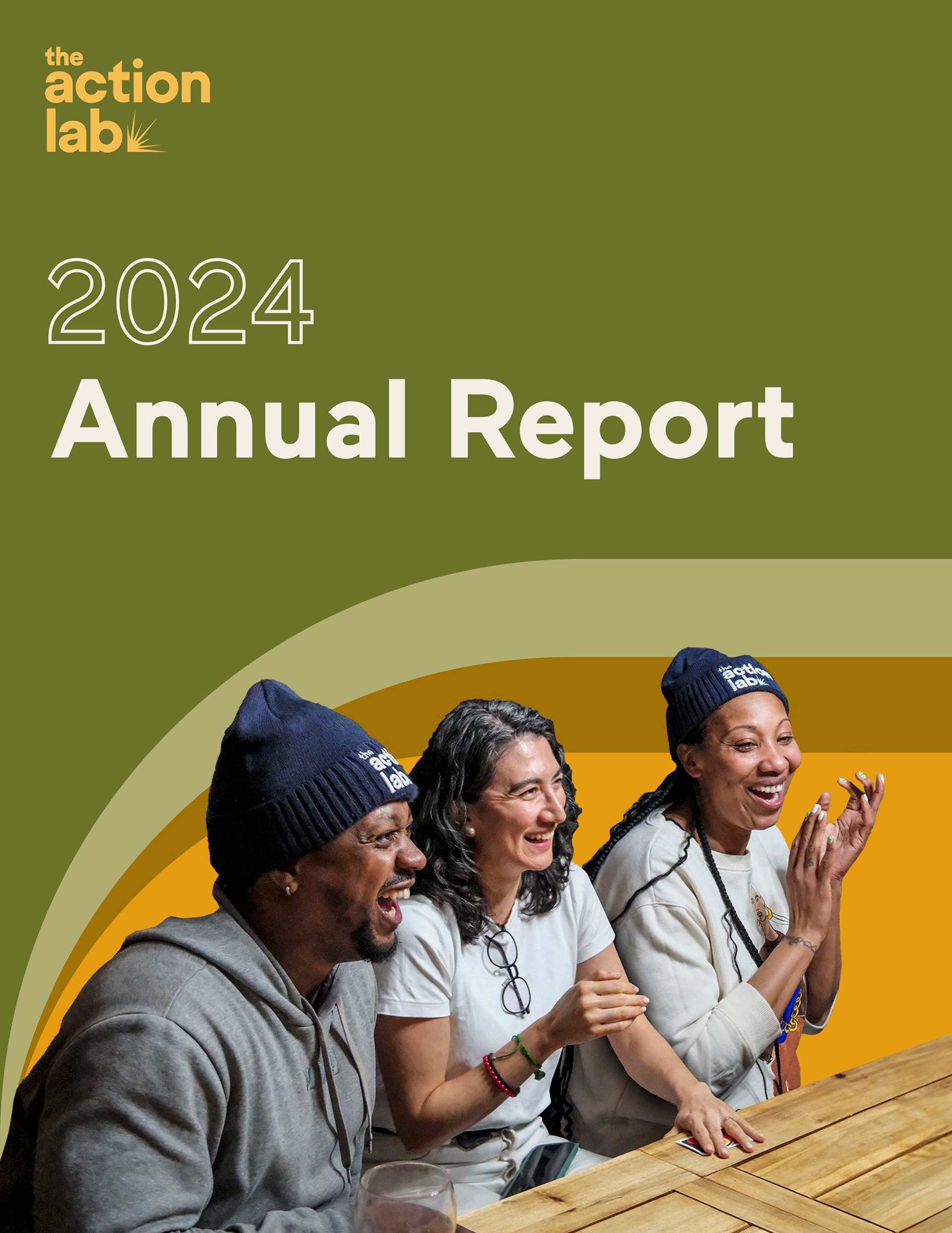 2024 Annual Report cover featuring three people laughing at a wooden table