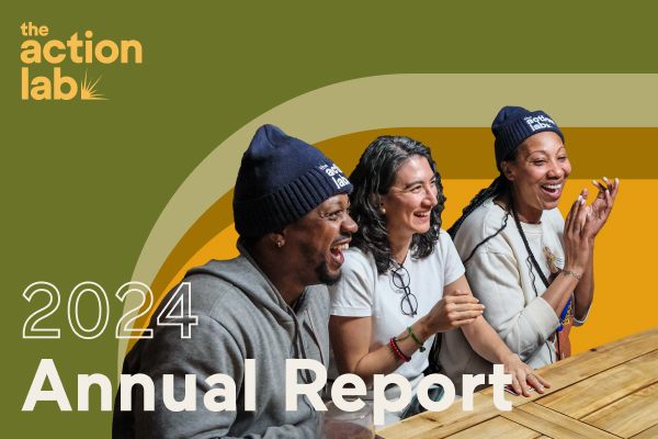 2024 Annual Report cover featuring three people laughing at a wooden table