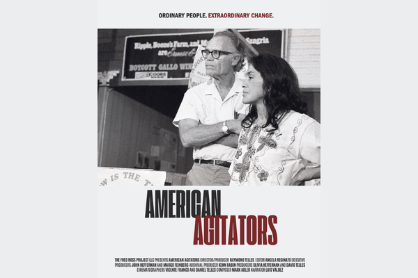 Older white man with black glassess standing behind latina woman with shoulder length black hair in black and white over the title American Agitators in burgundy
