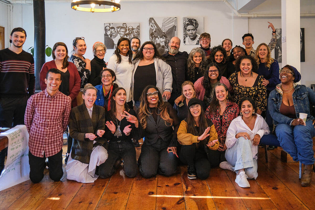 Woman speaks in a discussion group in a room.