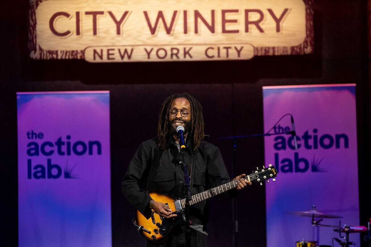 Audience engaged and clapping at a performance.