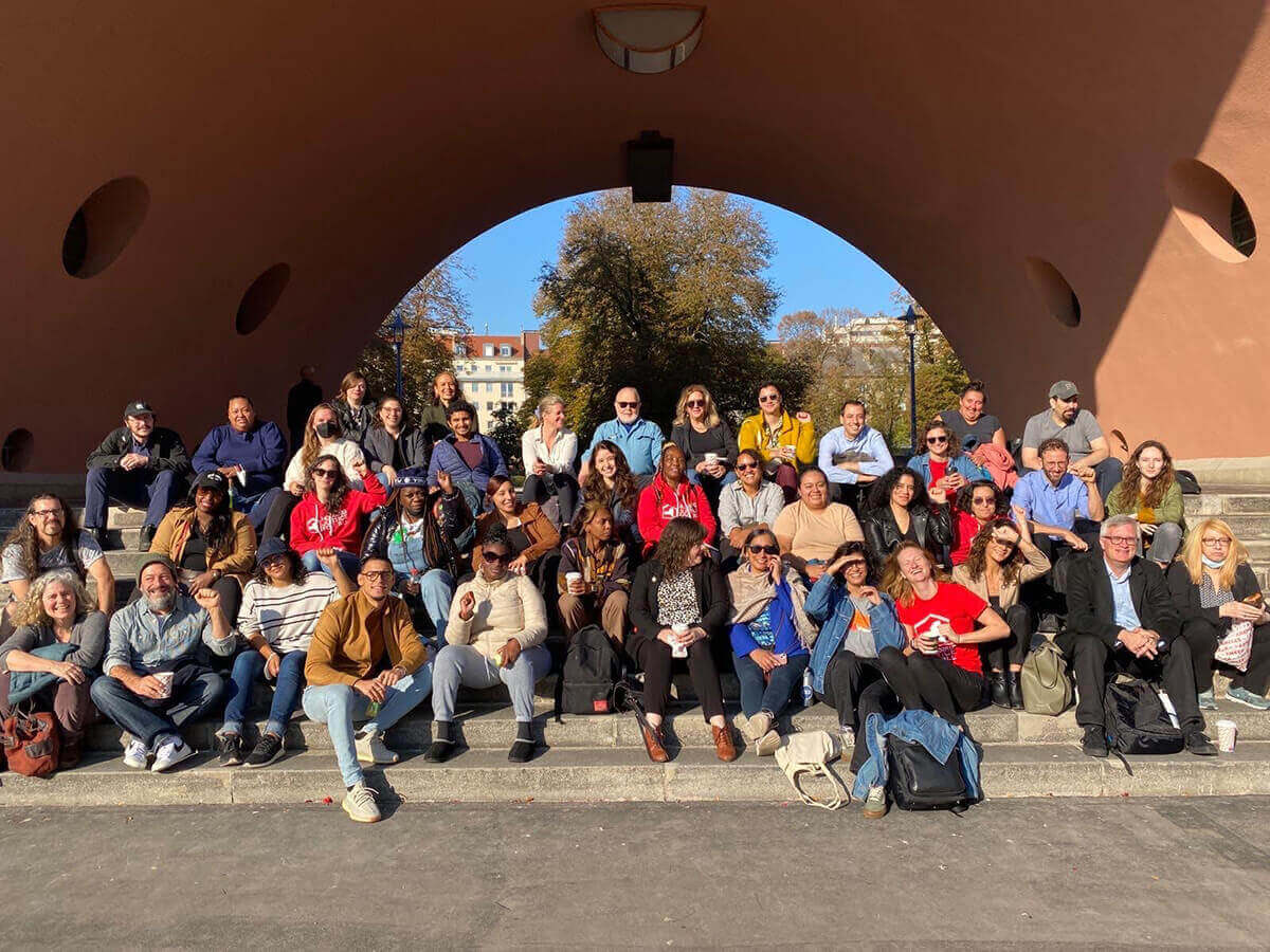 Large group posed for a photo at an outdoor gathering.